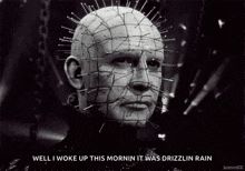 a black and white photo of a man with pins in his head and the words `` well i woke up this morning it was drizzlin rain ''