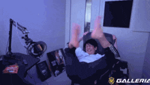 a person laying on a chair with their feet up and a galleria logo in the background