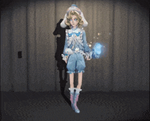 a girl in a bunny costume is holding a blue object