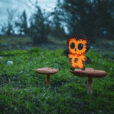 a cartoon owl holding a light bulb sits on a mushroom in the grass