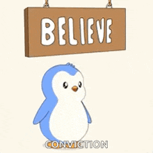 a penguin is holding a sign that says believe