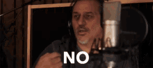 a man in a recording studio says no