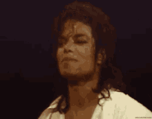 a close up of a man 's face with the words dancingmachine written below him
