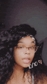 a woman wearing glasses and a leopard print headband has the date 10/10/10 on her face