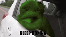a green monster is sticking its head out of a car window with the words gleep boxing written below it