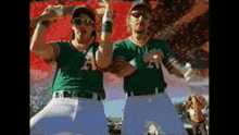 a couple of baseball players with a on their jerseys