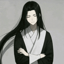a man with long black hair has his arms crossed and his eyes closed