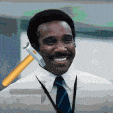 a man in a white shirt and blue tie is smiling with a hammer on his shoulder