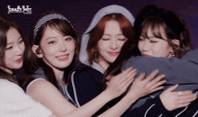 a group of girls hugging each other with the words easy crazy hot written on the bottom