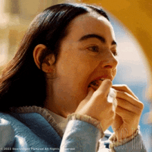 Stuffing Foods Inside The Mouth Bella Baxter GIF