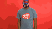 a man wearing a mask and a shirt that says " shake it off "