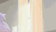 a close up of a person sitting in front of a window in a room .