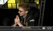 a man sitting in a gaming chair with the words best of five picking phase 1