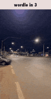 a picture of an empty street at night with the words wordle in 3 below it