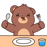a brown teddy bear is sitting at a table with a plate and a glass of water