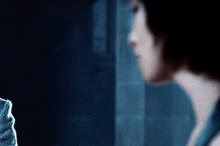 a blurry picture of a woman 's face and neck