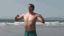 Timothy Mc Gaffin Flexing Muscles GIF - Timothy Mc Gaffin Flexing Muscles Beach GIFs