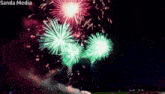 fireworks are displayed in the night sky with the words sanda media above them