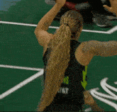 a female basketball player wearing a jersey that says ms at & t