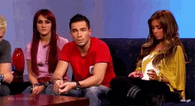 a group of people are sitting on a couch with the words wm channel on the bottom right