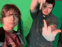 a man giving the middle finger to a woman