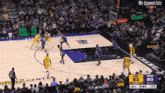 a basketball game is being played in front of a crowd with nba advanced stats displayed