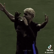 a tiktok video of two soccer players with adounfx on the bottom