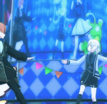 a man and a girl are dancing in front of a blue wall