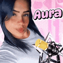 a woman with blue hair is holding a yellow microphone with the name aura written on it
