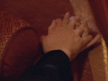 a close up of a man and woman kissing