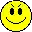 a pixel art illustration of a smiley face with its tongue out .