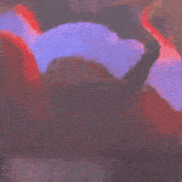 a blurry picture of a person 's face with a purple background