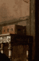 a wooden table with a box on top of it that says ' r & r ' on it