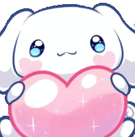 a white bunny is holding a pink heart in its hands .