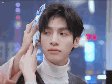 a close up of a person holding a bag of ice