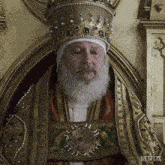 a man with a beard is wearing a crown and a netflix advertisement