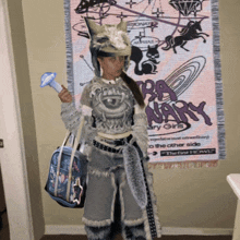 a woman is standing in front of a poster that says " rary girls "