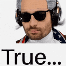 a man wearing sunglasses and headphones with the word true behind him