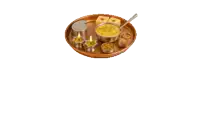 a wooden tray with a bowl of soup and some candles on it