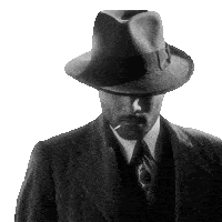 a man wearing a hat and a suit smoking a cigarette