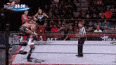 a wrestling match is being shown on a screen that says double nightmare