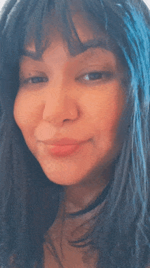 a close up of a woman 's face with her eyes closed and her mouth open