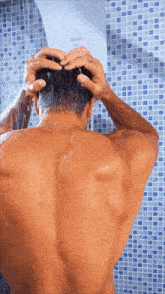 a man taking a shower with a shower head that says ' zephyr ' on it