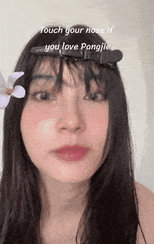 a close up of a woman 's face with the caption touch your nose if you love pangjie