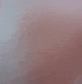 a girl wearing a pink hijab and a white hat makes a peace sign