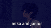 a man in a suit and tie is talking to another man with the words mika and junior on the bottom