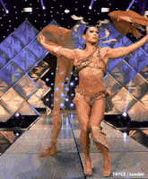 a woman in a costume is dancing on a stage with t4yce tumblr in the lower right corner