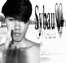 a black and white photo of a shirtless man with sybau written on the bottom right