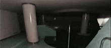 a person is standing in a dark room with a staircase .