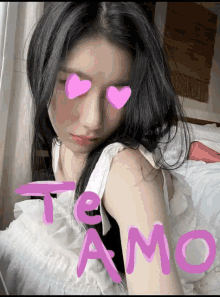 a woman with pink hearts on her eyes and the word te amo